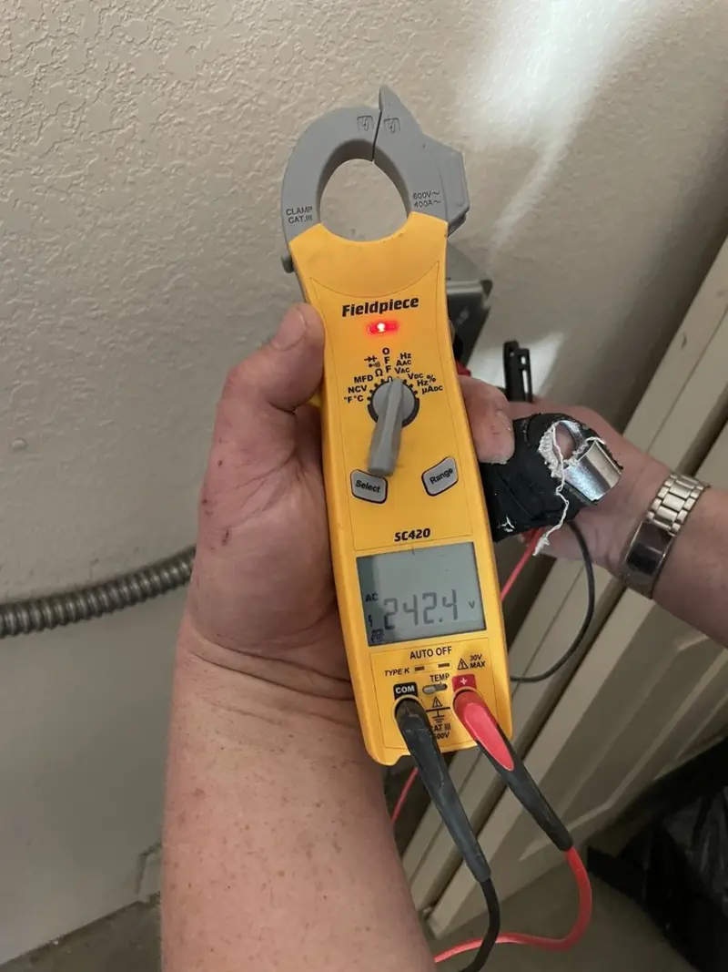 Voltage testing with clamp meter during Outlet Installation in Solebury